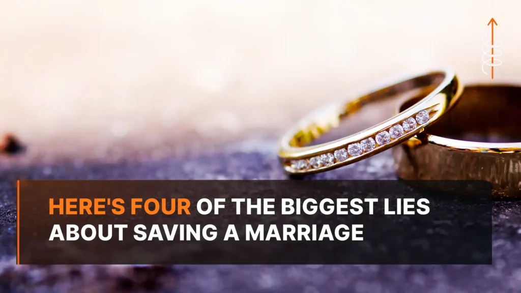 Two wedding rings sitting apart on a cracked surface, symbolizing the distance couples face when saving a marriage